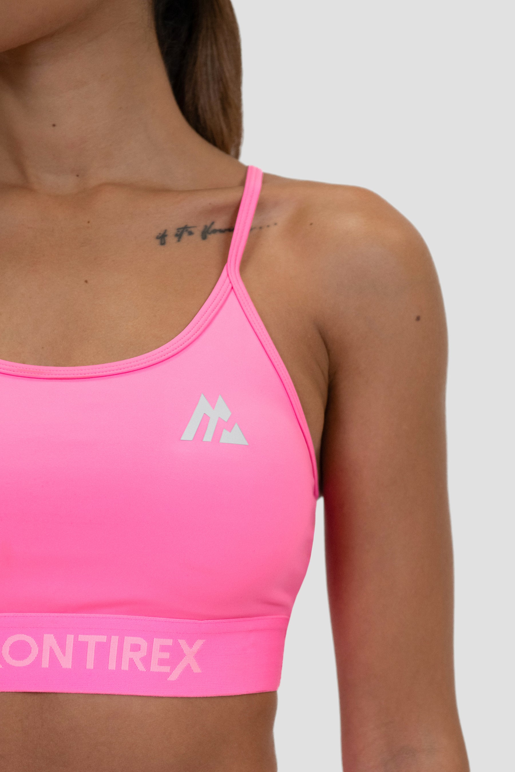 Pink strappy sports bra deals